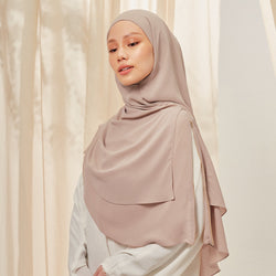 Islamic khimar in sandy beige color from TudungPeople, featuring a soft, flowing fabric for modest coverage and elegant style.