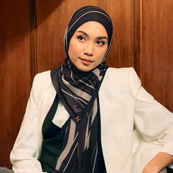 Prints TudungPeople Stripes in coal color, showcasing a stylish, patterned headscarf with bold stripe design.