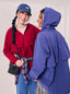 Adjustable TudungPeople parka in neutral color, featuring a hood, zipper closure, and adjustable drawstrings for a comfortable fit.