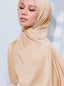 Inaya Satin Signatures tudung by TudungPeople featuring smooth satin fabric and elegant design, displayed on a flat surface.