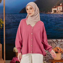 Raspberry-colored knitted cardigan from TudungPeople, showcasing cozy knit fabric and front button closure.