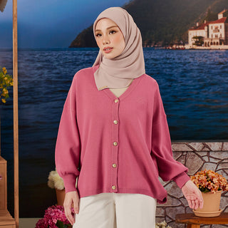 Raspberry-colored knitted cardigan from TudungPeople, showcasing cozy knit fabric and front button closure.