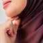 Niya Chiffon 2.0 instant in Sangria by TudungPeople, showcasing the flowing chiffon fabric and vibrant deep red color.