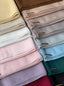 Close-up of TudungPeople Suri signature hijab, showcasing elegant fabric and detailed stitching.