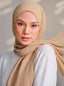 Suri Cotton TudungPeople Signature hijab in soft white fabric, neatly folded and displayed on a plain background