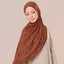TudungPeople TDJ Tanah print scarf with earthy brown and beige tones, showcasing intricate traditional pattern design.