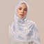 Colorful Telang print hijab by TudungPeople, featuring intricate floral patterns on lightweight fabric.