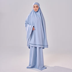 A dusty blue Aman Luxe prayerwear set by TudungPeople, featuring modest design and comfortable fabric for prayer and daily wear.