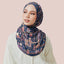 Dark blue print from TudungPeople's Atelier collection featuring intricate navy design on fabric.