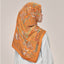 Warm orange print from TudungPeople's Atelier collection, featuring a stylish square design with vibrant, eye-catching colors.