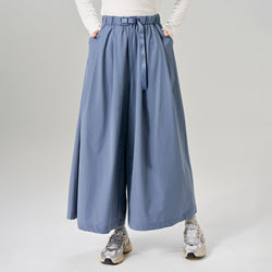 Light gray baggy pants by TudungPeople made from soft fabric, featuring a relaxed fit and casual style.