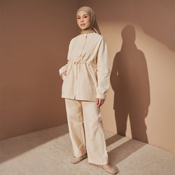 Cream TudungPeople field jacket, stylish and casual apparel with a tailored fit, shown on a model.