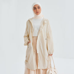 Eggshell long parka by TudungPeople, stylish and warm outerwear with a sleek, elongated design perfect for casual wear.