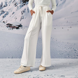 White TudungPeople sweatpants, casual apparel with a relaxed fit and soft fabric, shown on a hanger.