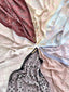Colorful Ikatan print by TudungPeople featuring intricate, vibrant patterns on high-quality fabric for stylish headwear.